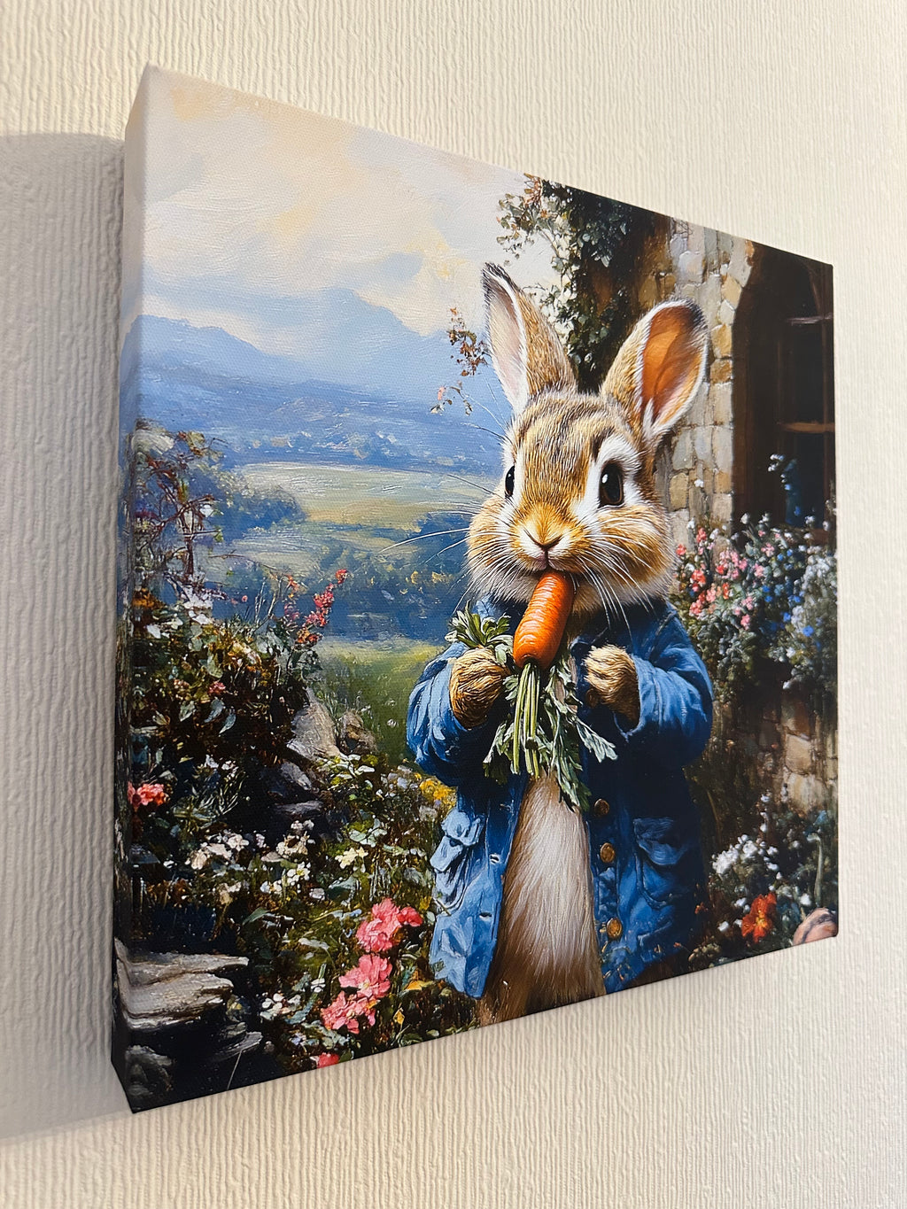 Canvas print of a rabbit holding a carrot with a scenic background on a wooden surface.