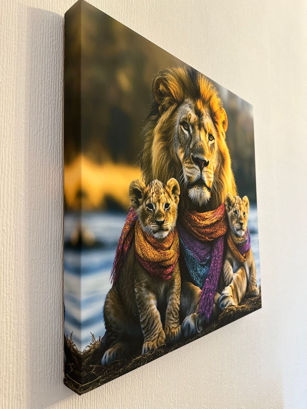 Canvas print of lions wearing colorful scarves on a light background