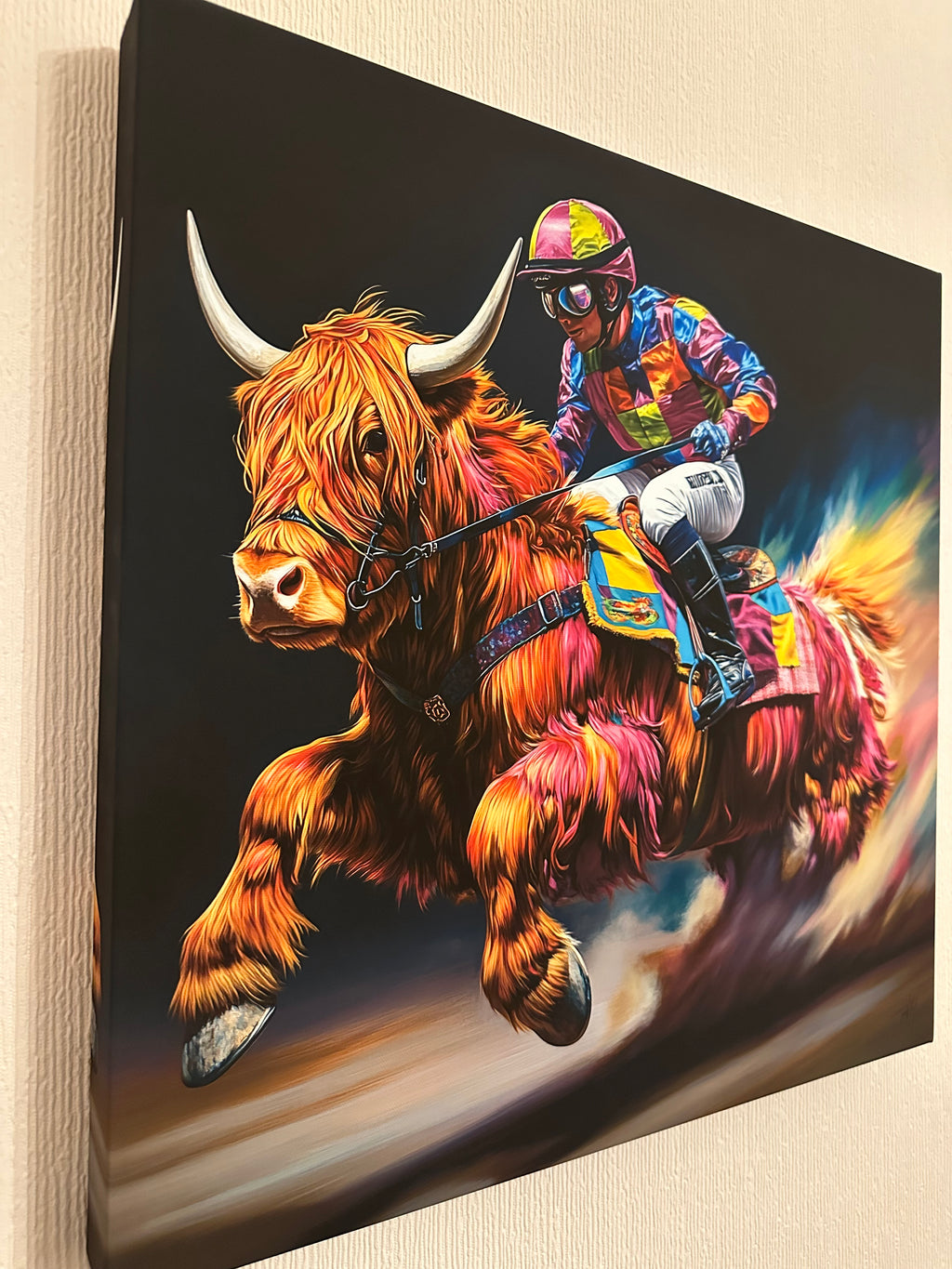 Colourful artwork of a highland cow and jockey
