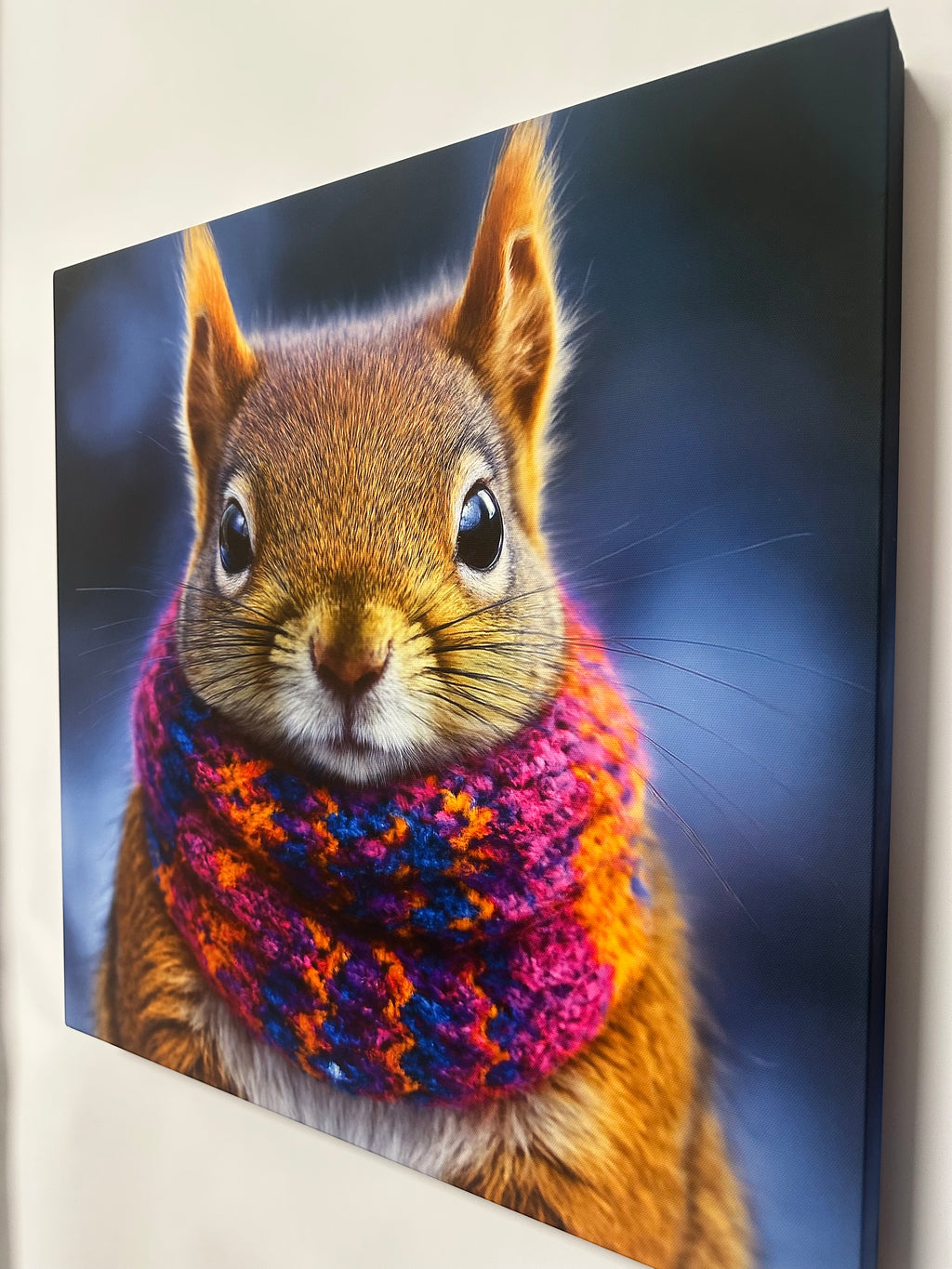 Squirrel wearing a colorful sweater against a dark background