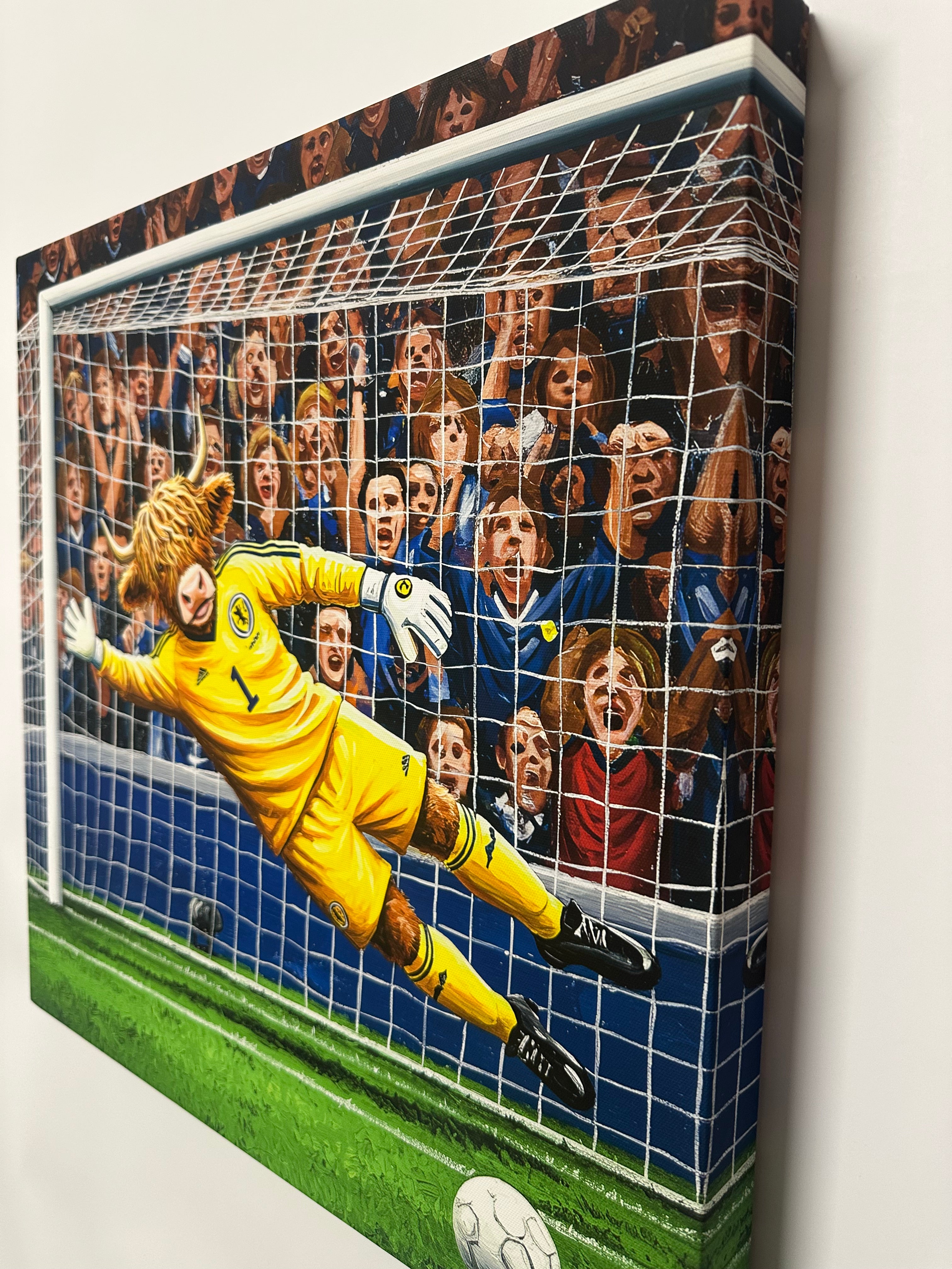 Soccer goal with goalkeeper diving to save a ball, surrounded by spectators.