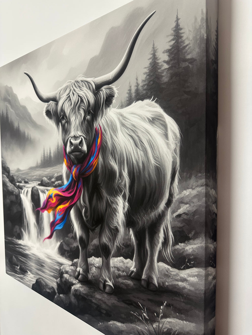 Black and white painting of a goat with colorful accents on a textured surface