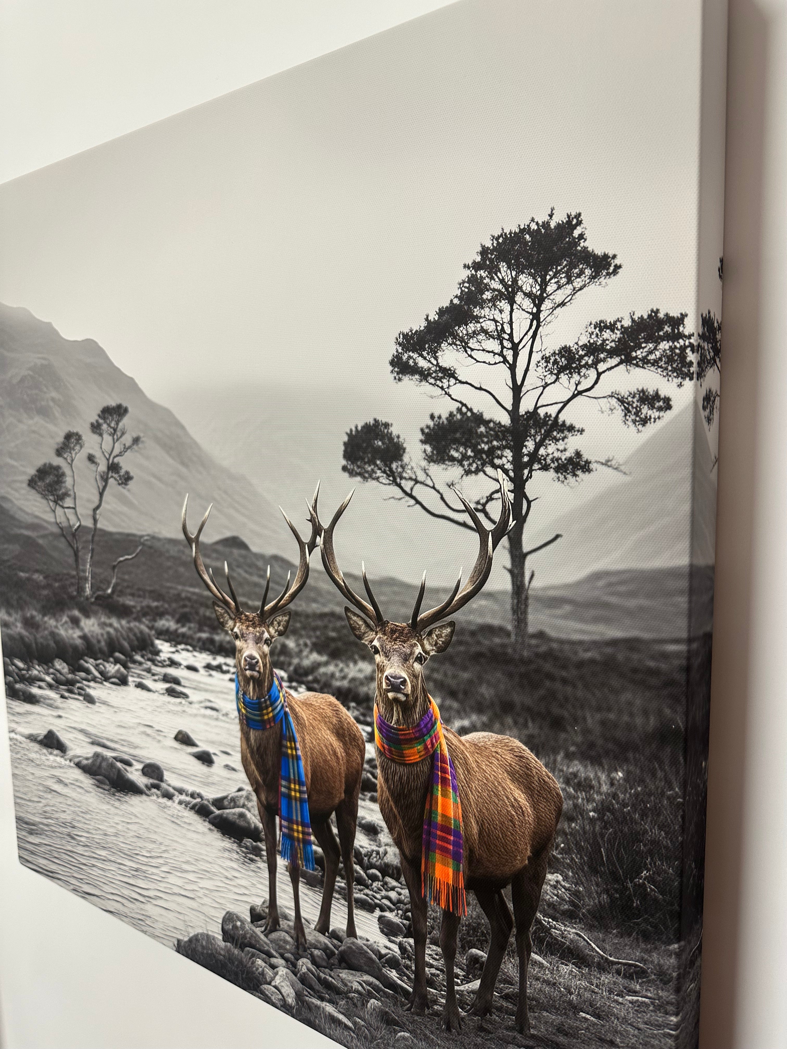 Two deer with decorative antlers standing on a rocky landscape.