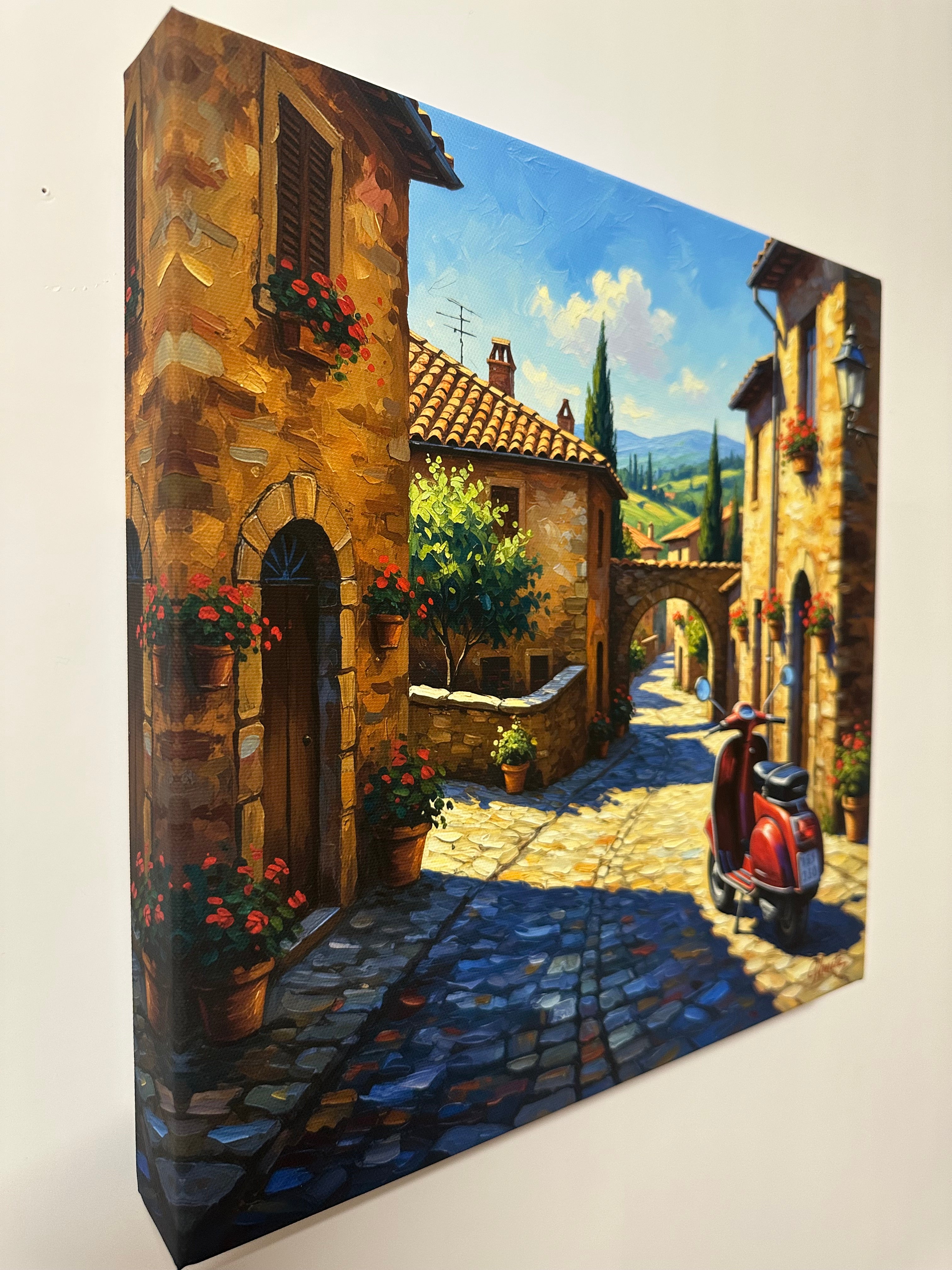 Print canvas wall art of a quaint village scene with cobblestone streets and buildings.