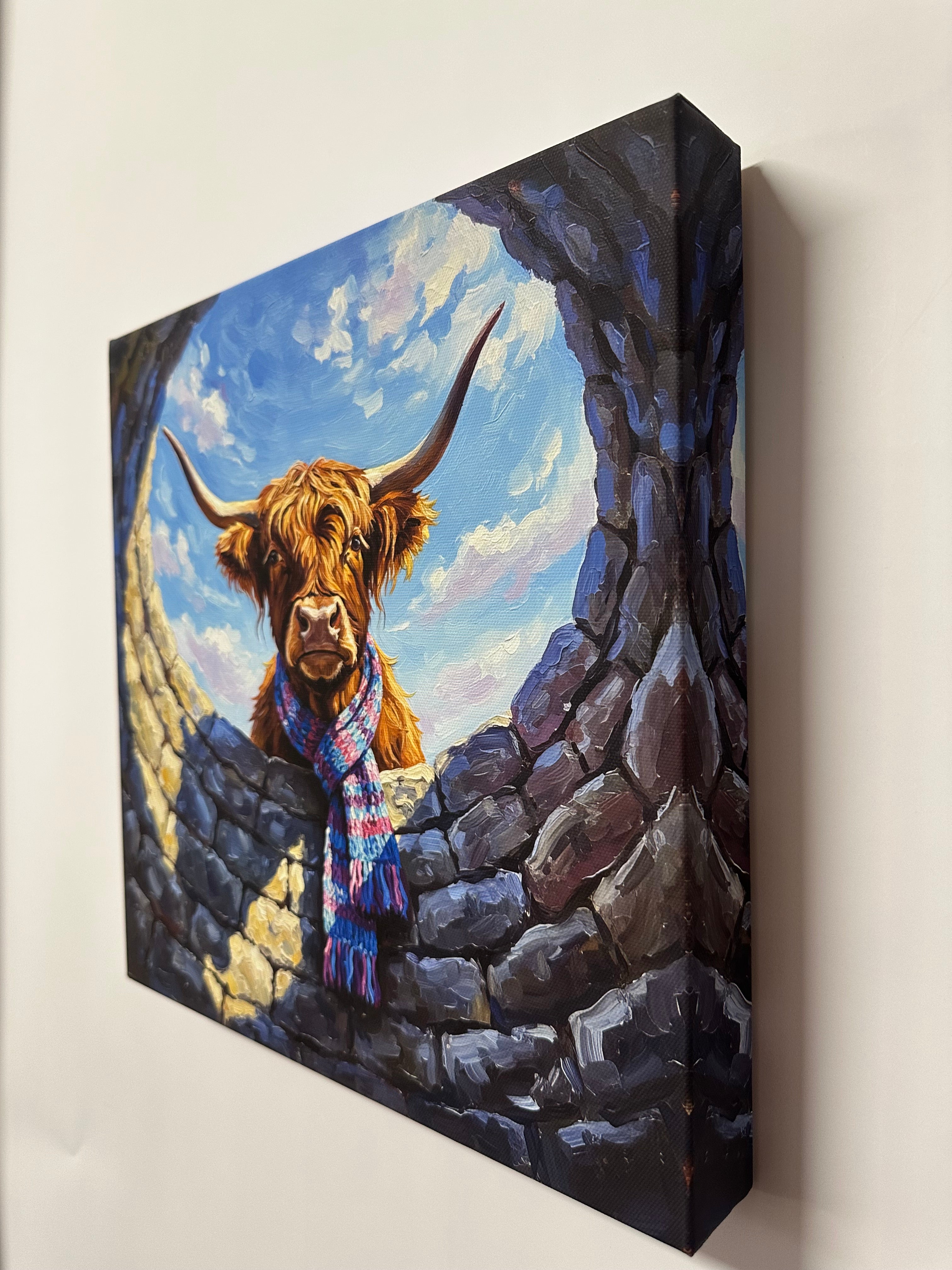 Print of Painting of a highland cow with a colourful scarf down a stone water well.