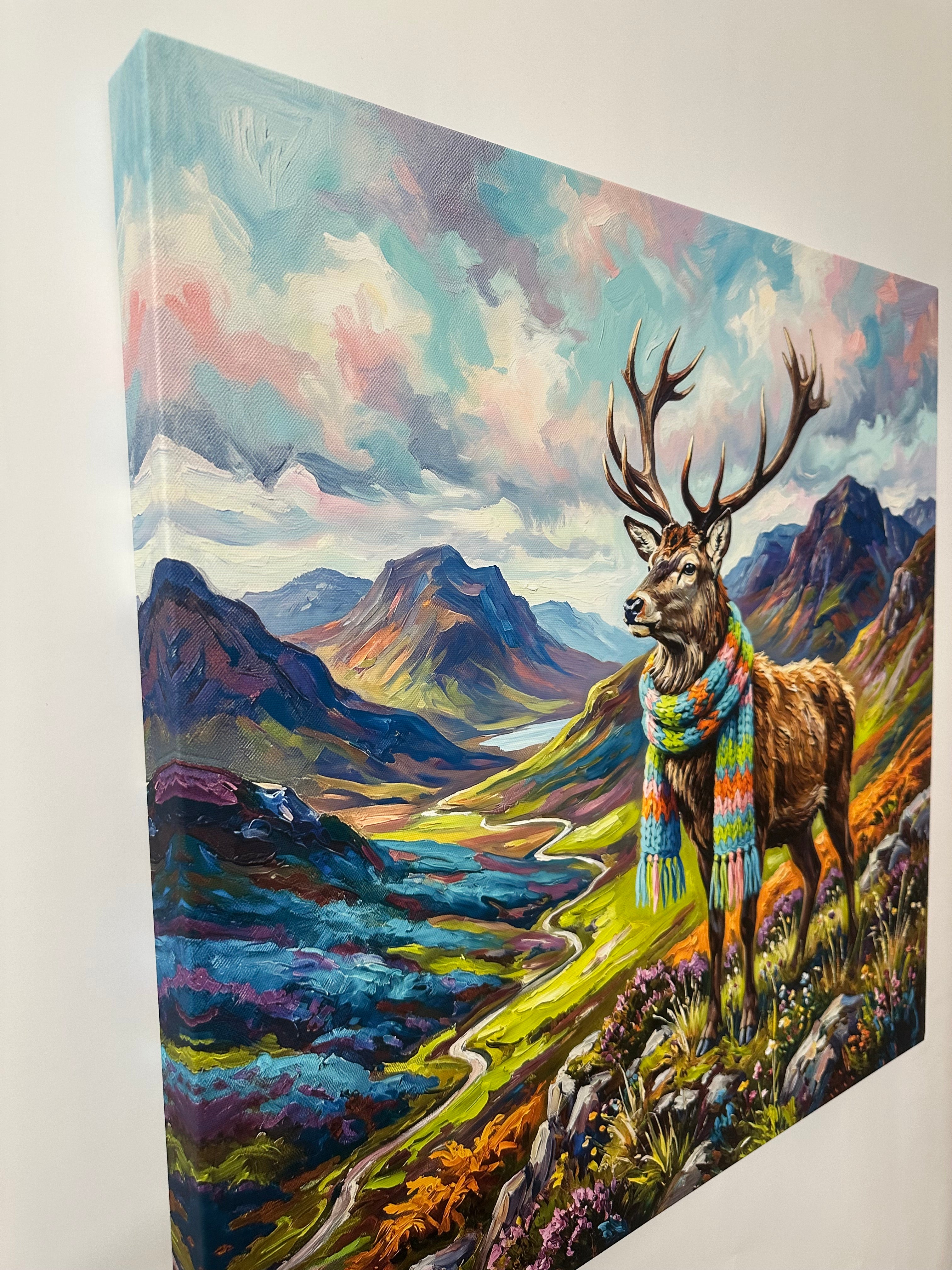 Colourful painting print of a deer with antlers on a mountainous landscape