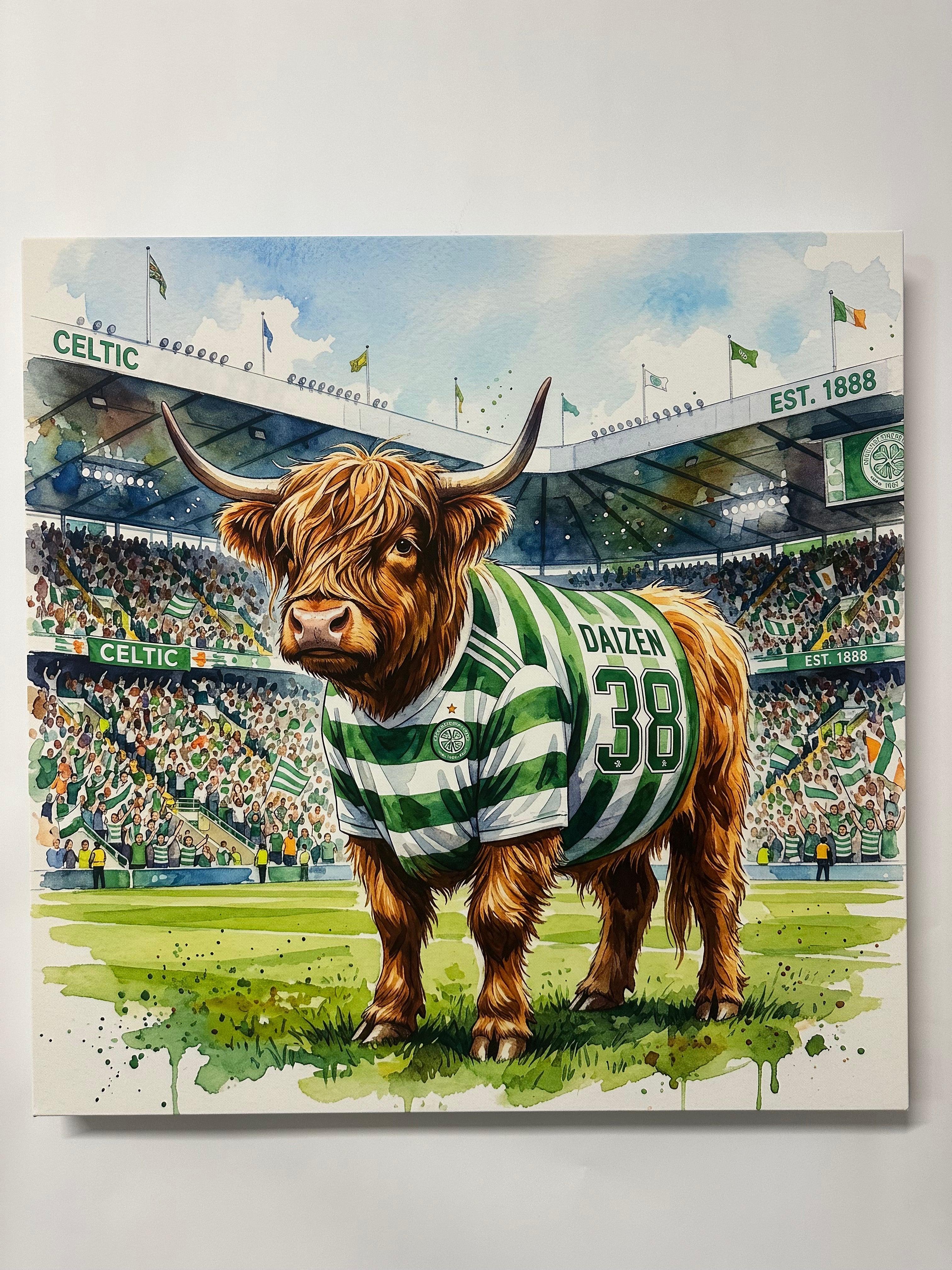 Print of a Highland cow wearing a green and white striped jersey with the number 38, set against a stadium background.