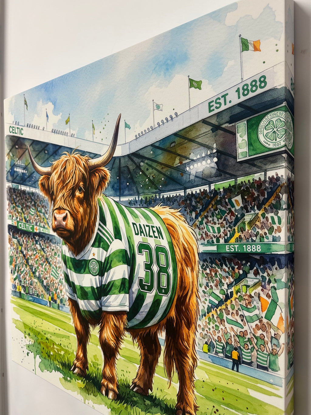 Highland cow wearing a green and white striped shirt with number 38, standing in front of Celtic FC stadium.