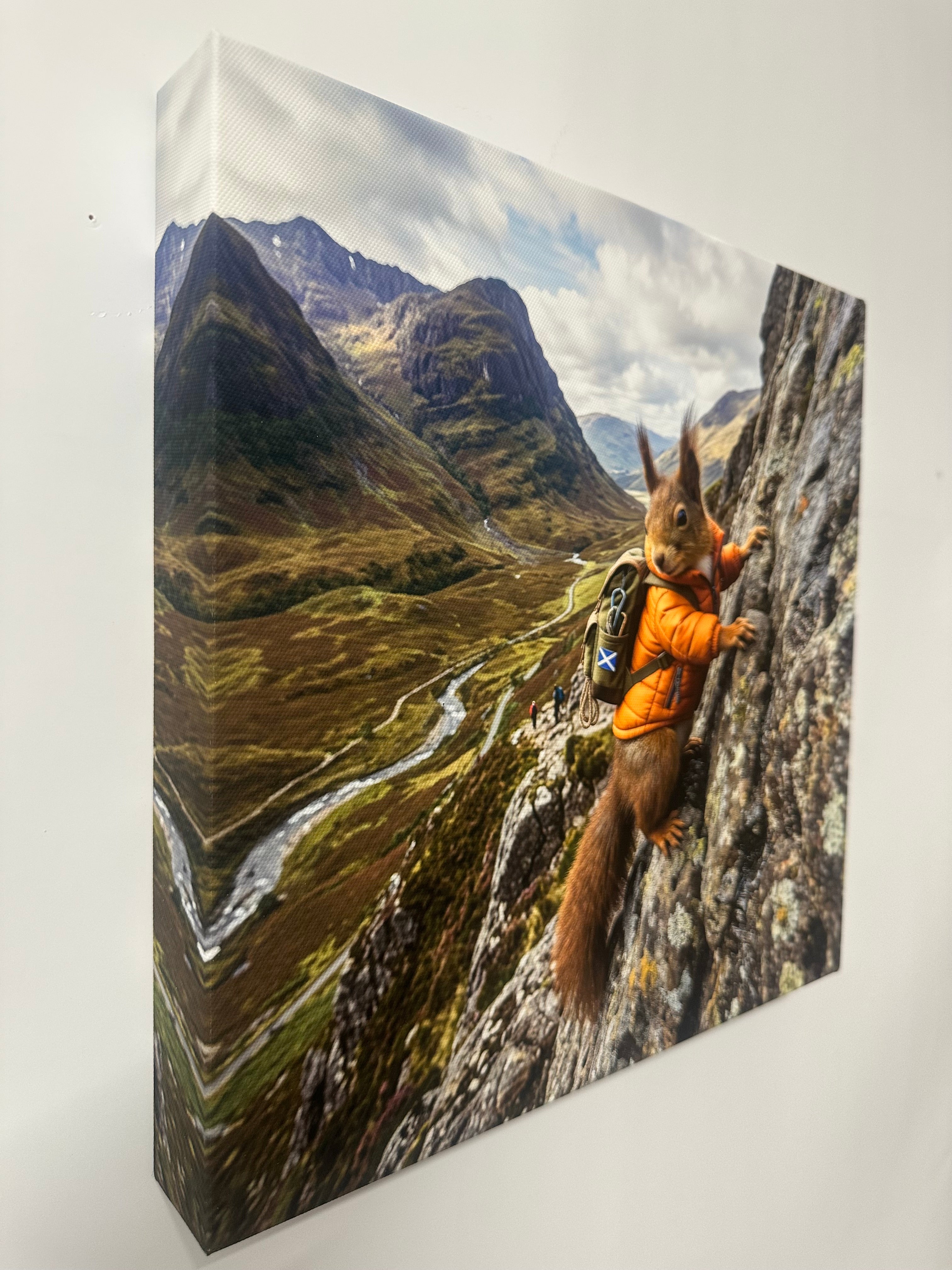 Squirrel climbing a mountain with a scenic view of a mountain range 