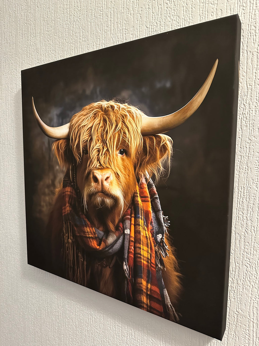 Canvas print of a highland cow with a plaid scarf canvas wall art
